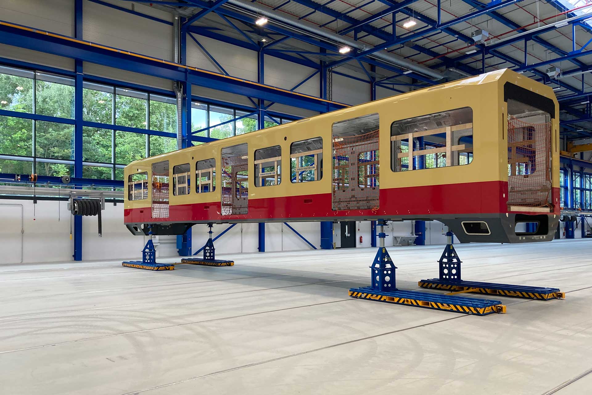 Transportsysteme für die Produktion von Bus und Bahn